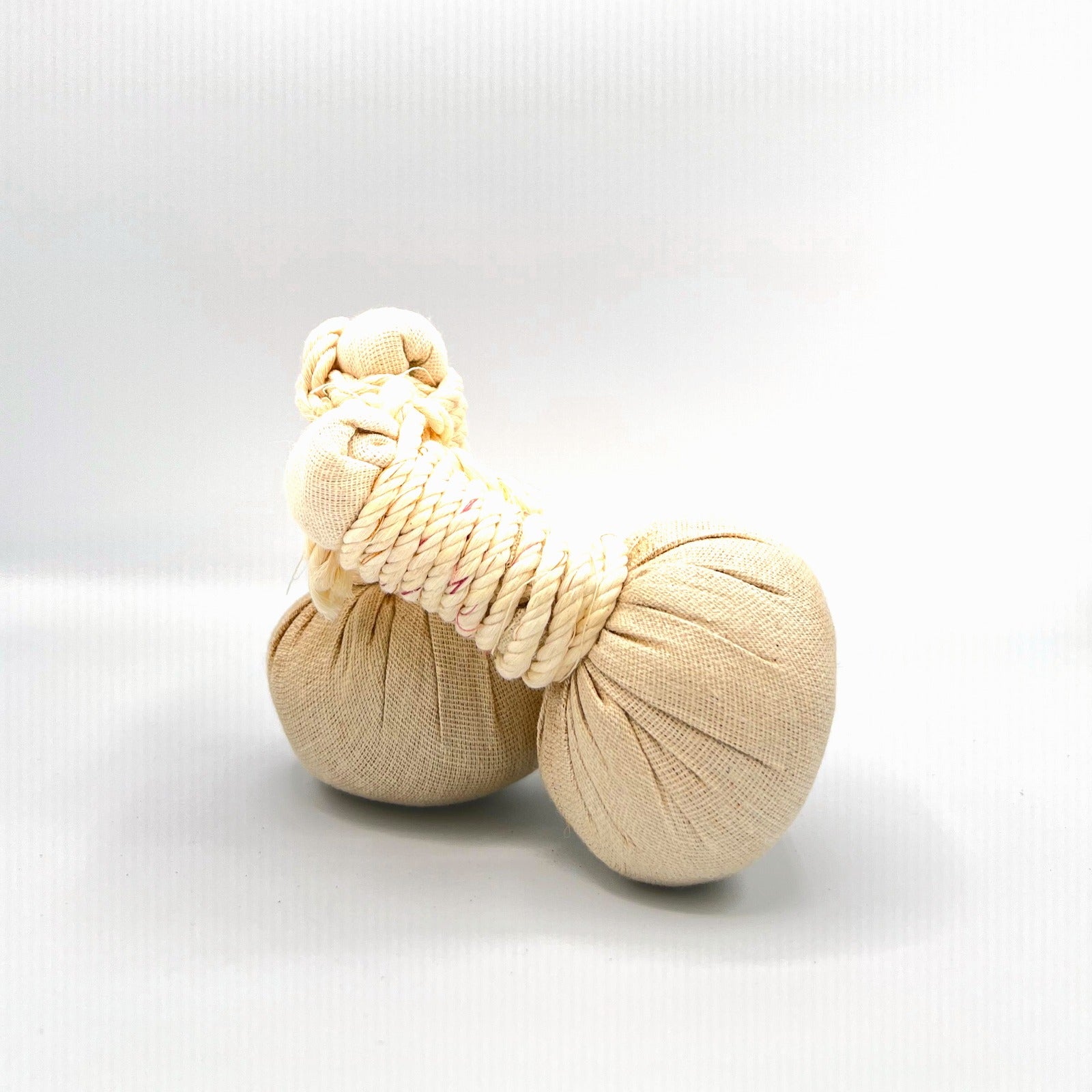 Kizhipotli herbal massage potli, side view - Kairali Ayurvedic Products